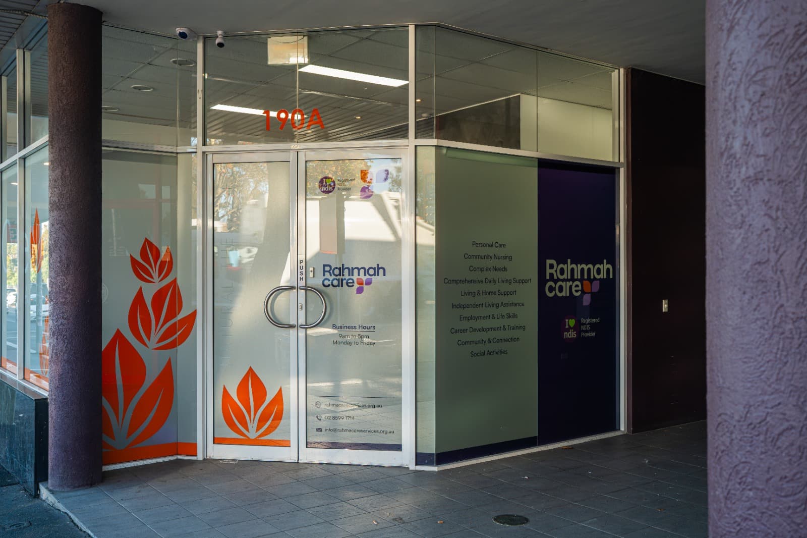 Entrance to the Rahmah Care Services office, with the Rahmah Care signage and NDIS Registered Provider logo displayed on the windows.